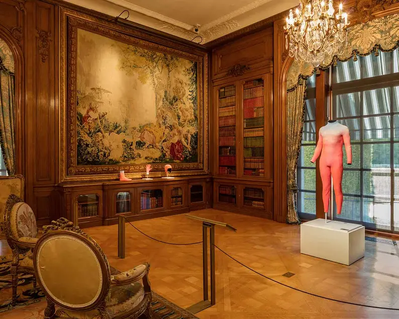 Alex Israel's Self-Portrait (Wetsuit), 2015, among 18th-century French tapestries in the Large Library. Photo by Fredrik Nilsen, courtesy of The Huntington.