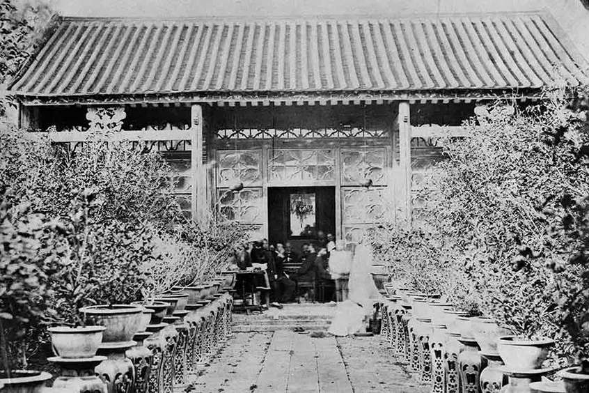 Old photograph of a gathering in a Chinese garden