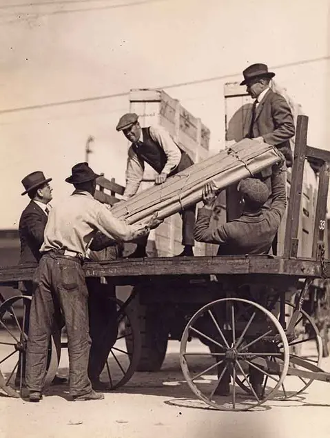 Photo by "International," Los Angeles Bureau. "Famous Painting Arrives." The Blue Boy being unloaded from a train, 1922. The Huntington Library, Art Museum, and Botanical Gardens.