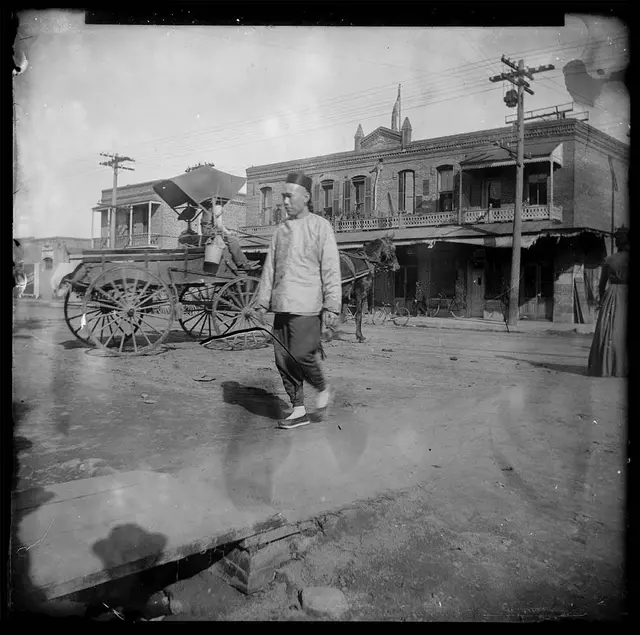 Unknown photographer, Chinese man walking near the intersection of Alameda Street and Marchessault Street in Old Chinatown, Los Angeles, ca. 1900. The Huntington Library, Art Museum, and Botanical Gardens.