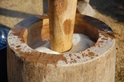 A traditional wood bowl and hammer to pound mochi.