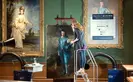 Conservator using tiny brushes to reconnect Gainsborough's brushstrokes