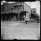 Unknown photographer, Chinese woman walking at the intersection of Alameda Street and Marchessault Street in Old Chinatown, Los Angeles, ca. 1900. The Huntington Library, Art Museum, and Botanical Gardens.