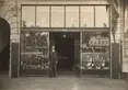 Photo of Fong See standing in front of F. Suie One Co., located on 510 Los Angeles St., ca. 1910s. Unknown photographer. The Huntington Library, Art Museum, and Botanical Gardens.