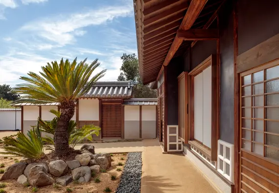 Close-up view of the front entrance and courtyard of a traditional Japanese home.