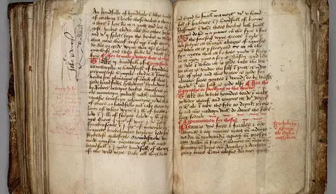 Two pages from a 15th century manuscript with notes in the outer margins.