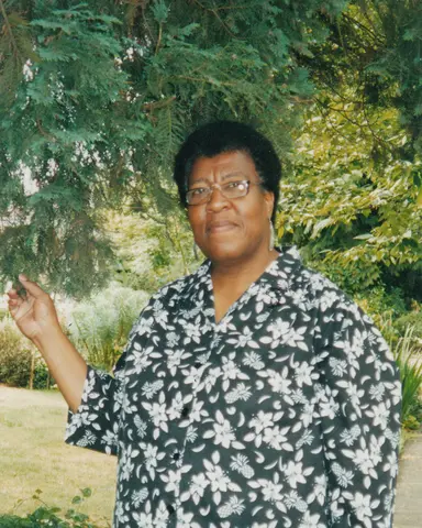 Octavia E. Butler standing by a tree