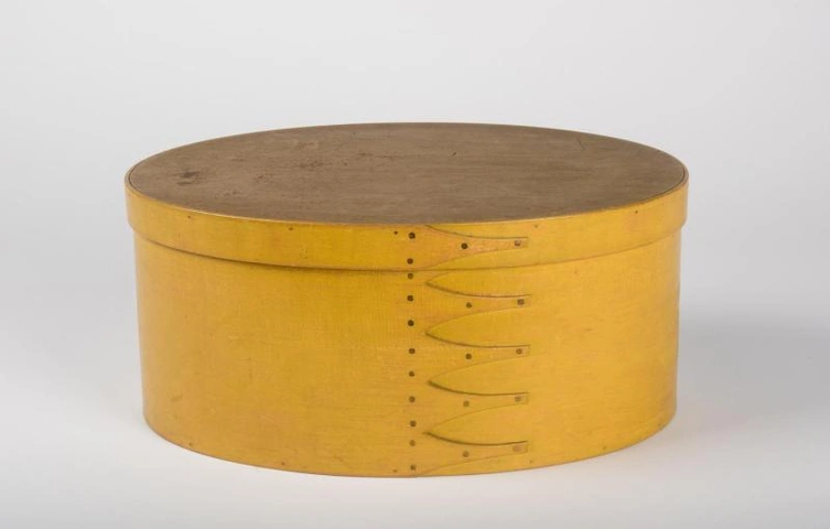 Unrecorded artist (American), Oval Shaker box, probably New Lebanon, New York, ca. 1820-1840, pine and maple, tacks, chrome yellow finish. Jonathan and Karin Fielding Collection, L2015.41.27 