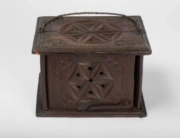 Unrecorded artist (American), Chip-carved foot warmer, Eastern Massachusetts, ca. 1720, oak and iron. Jonathan and Karin Fielding Collection, L2015.41.29 