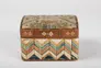 A small colorful box with a lid is decorated with lengths of porcupine quills forming a geometric design on the lid and chevron patterns on sides.