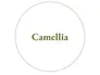 The text Camellia inside a white circle outlined in green.