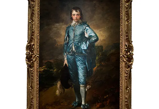 A framed painting of a boy in blue clothing.
