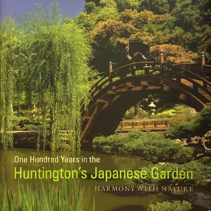 A book cover with a bridge over a pond in a Japanese style garden.