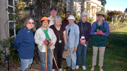 Rose Garden volunteers pause for a quick group portrait before getting back to business