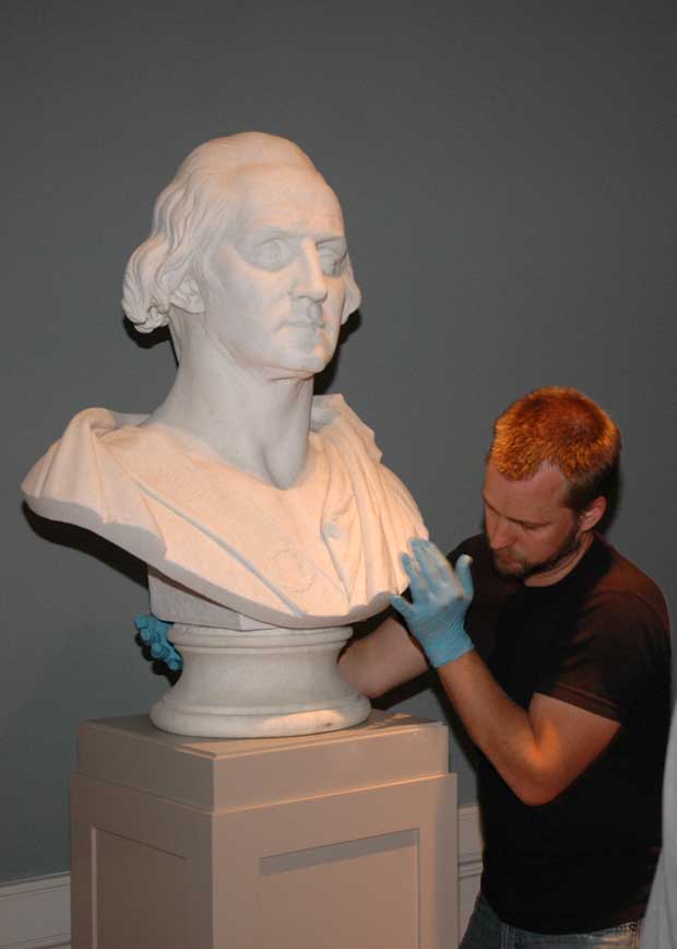 Jay Raveling with a bust of George Washington