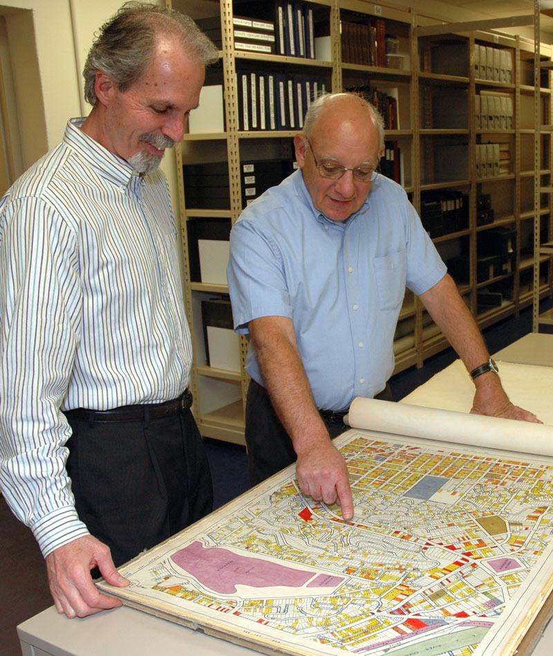 Alan Jutzi and David Mihaly look at one of the L.A. city maps 