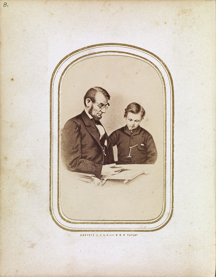 Abraham Lincoln and his son Tad Lincoln looking at a photograph album in photographer Mathew Brady’s gallery, Washington, D.C., Feb. 9, 1864. Photograph by Anthony Berger. The Huntington Library, Art Collections, and Botanical Gardens.