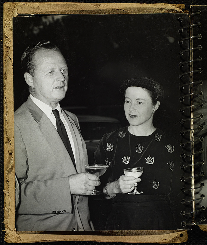 Millard Sheets and his wife, Mary Sheets, at a party related to the “Arts of Daily Living” exhibition at the Los Angeles County Fair in Pomona, 1954. Photo by Maynard L. Parker. The Huntington Library, Art Collections, and Botanical Gardens.