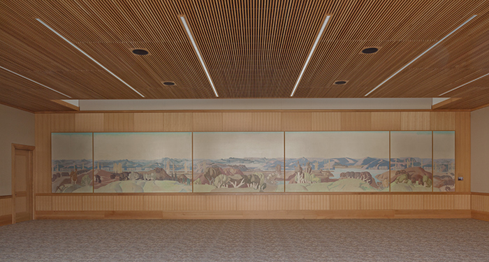 Mural for the Home of Fred H. and Bessie Ranke, 1934, by Millard Sheets. Gift of Larry McFarland and M. Todd Williamson. Depicting a bucolic California landscape of stylized hills and trees, the mural was painstakingly removed and conserved before being installed in the Stewart R. Smith Board Room at The Huntington. Photo by Tim Street-Porter. The Huntington Library, Art Collections, and Botanical Gardens.
