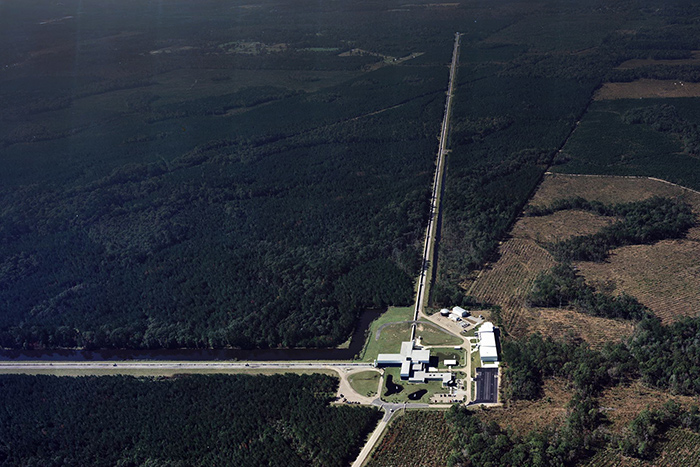Aerial shot of the LIGO Livingston Lab, located in Louisiana. Although considered a single observatory, LIGO comprises four facilities across the United States: two gravitational wave detectors and two university research centers. The detectors, separated by 1,865 miles, are located in Livingston, Louisiana, and Hanford, Washington. The two primary research centers are located at Caltech and MIT. Photo courtesy of LIGO.