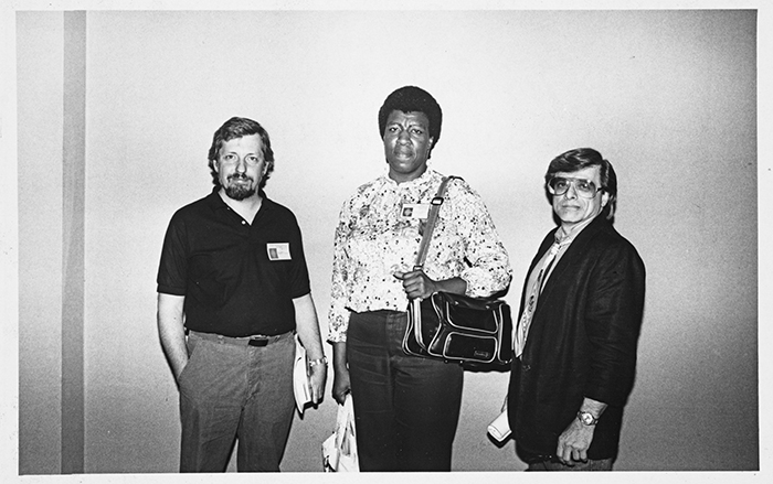 Octavia E. Butler (center) with Harlan Ellison (right) and unidentified man at the Conference on the Fantastic in the Arts, photographer unknown, 1988. Octavia E. Butler papers. The Huntington Library, Art Collections, and Botanical Gardens. Copyright Estate of Octavia E. Butler.