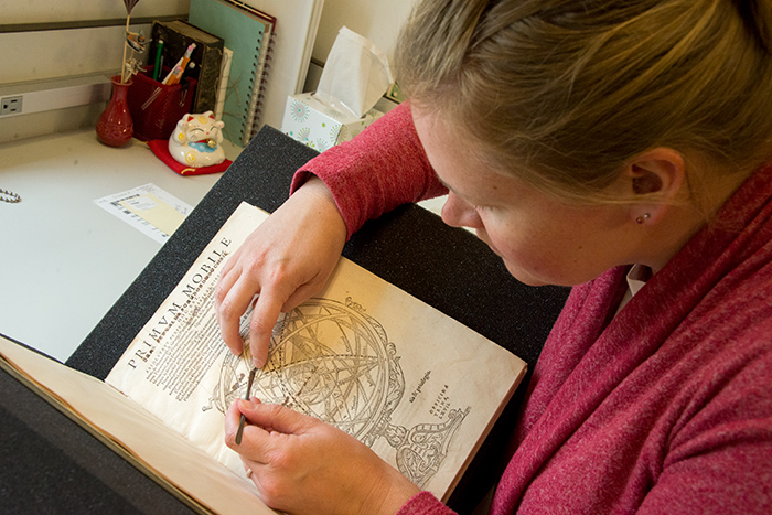 Kristi Westberg, the Dibner Book Conservator at The Huntington, works to preserve a copy of Primum mobile (Prime Mover), an astronomy book by the Austrian humanist and astronomer Erasmus Oswald Schreckenfuchs (1511–1579). Photo by Kate Lain.