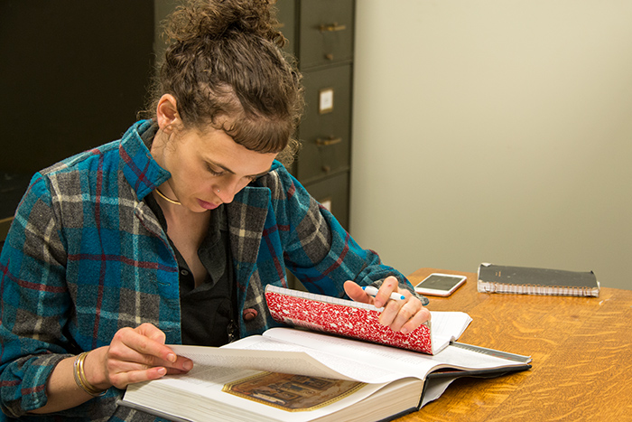 Juliana Wisdom conducts research at The Huntington. Photo by Kate Lain.