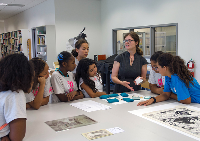 Paper conservator Jessamy Gloor discussed some of the tools and techniques she uses while showing the YWCA campers some of the rare documents currently receiving treatment.