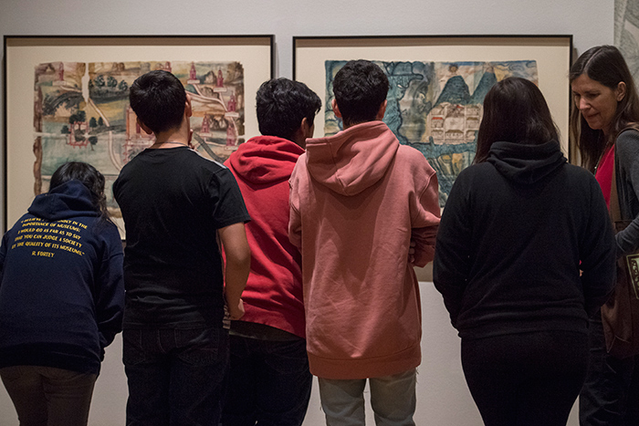 Eighth-graders from the Arroyo Seco Museum Science Magnet School in Los Angeles view maps at the exhibition “Visual Voyages: Images of Latin American Nature from Columbus to Darwin.” Photo by Martha Benedict.