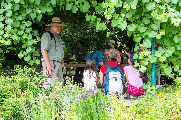 Master gardener volunteer Roger Gray talks with children during a recent Saturday open house at The Huntington’s Ranch Garden. Photo by Deborah Miller.