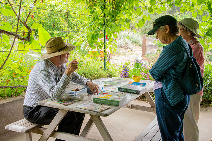 Mark Swicegood, a master gardener since 2004, talks to visitors at the Ranch Garden. Photo by Deborah Miller.
