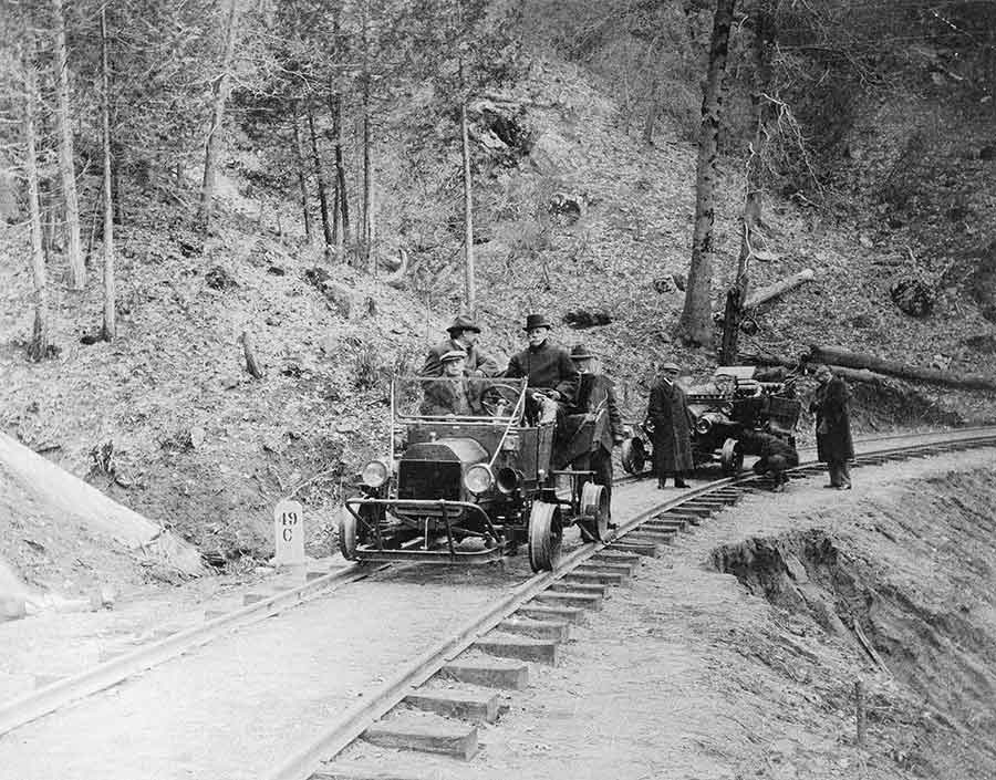 Henry E. Huntington (seated on the right in the backseat of the closer automobile), inspecting track at Big Creek, California, on April 7, 1914. In 1910, Huntington purchased the water rights to Big Creek, a branch of the south fork of the San Joaquin River in eastern Fresno County, and set about designing the first massively scaled hydroelectric project in the United States. Unknown photographer. The Huntington Library, Art Museum, and Botanical Gardens.