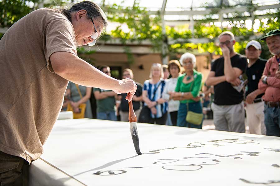On Nov. 4, 2018, contemporary artist Tang Qingnian gave a calligraphy demonstration at The Huntington, sharing a Tang-dynasty era poem, “Song of Eight Drinking Immortals,” that celebrates eight scholars who were known for their love of liquor. Photo by Jamie Pham.