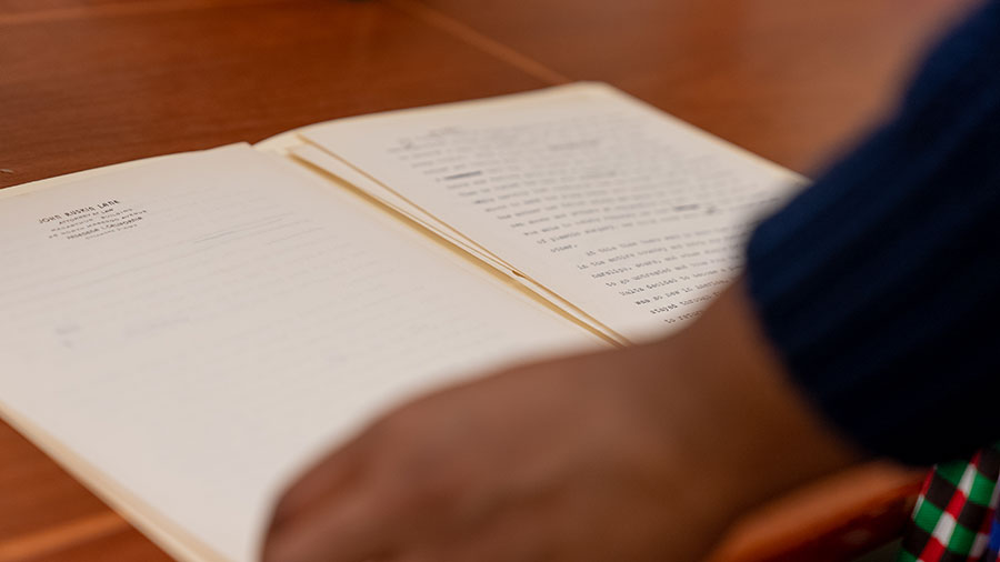 Alyssa Collins reads a typewritten page from the Octavia E. Butler papers, the most frequently consulted collection in the Library. Photo by Aric Allen.