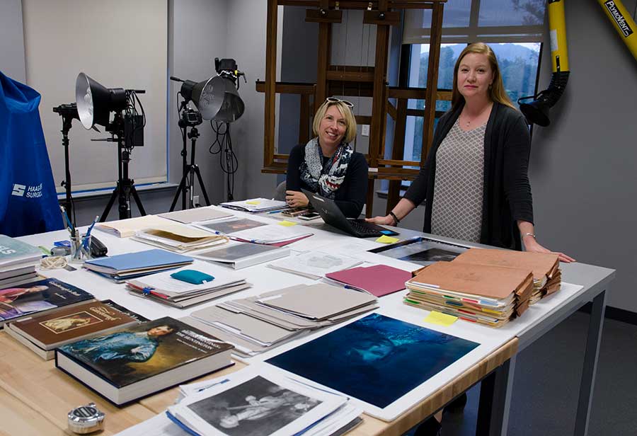 Melinda McCurdy in 2018 with Christina O’Connell, Mary Ann and John Sturgeon Senior Paintings Conservator, preparing for the exhibition “Project Blue Boy.” Photo by Deborah Miller.