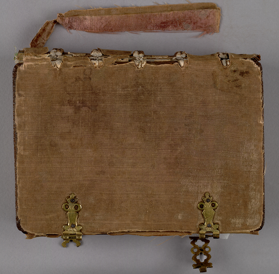 Binding inside front cover, showing pegging of the thongs and offset of the former pastedown. Huntington Manuscript 1200. The Huntington Library, Art Collections, and Botanical Gardens.