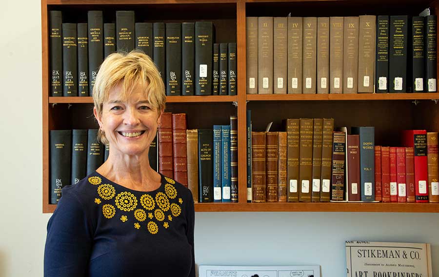 Ferrell in the office she used during her 2018–19 fellowship year at The Huntington. Behind her are volumes from the Library’s stacks that were essential for her research. Photo by Deborah Miller.